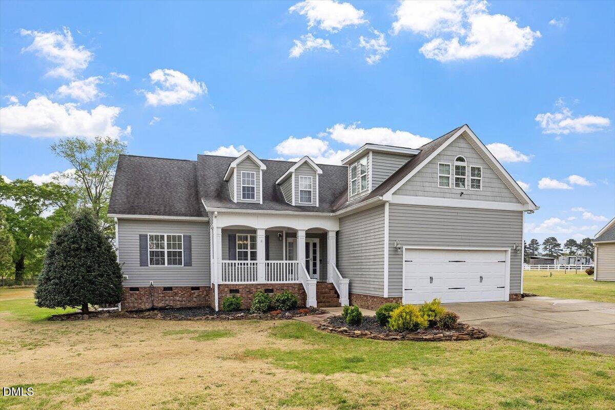 118 Victory Circle Willow Spring, NC 27592 - Photo 2 of 42 a front view of a house with a yard