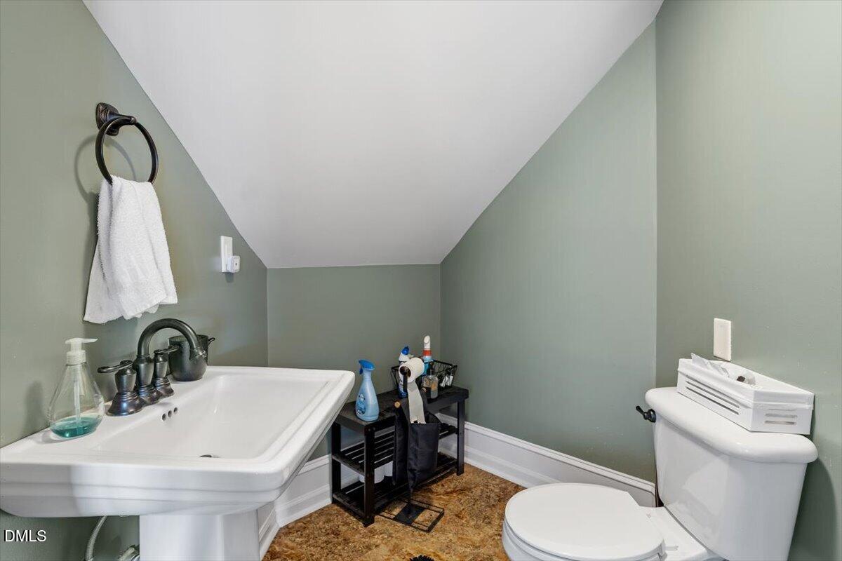 118 Victory Circle Willow Spring, NC 27592 - Photo 38 of 42 a bathroom with a sink and a toilet