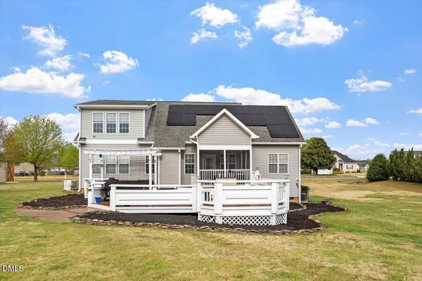 a front view of a house with a ocean view