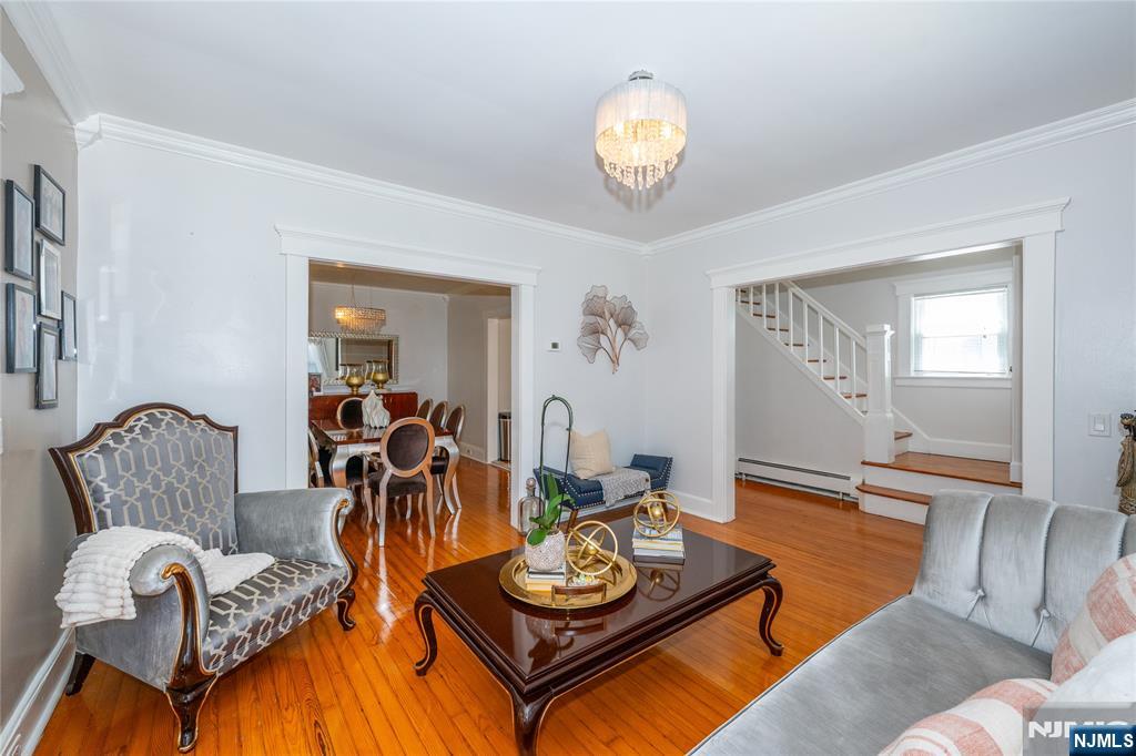 690 Garden Street Maywood, NJ 07607 - Photo 8 of 49 a living room with furniture and wooden floor