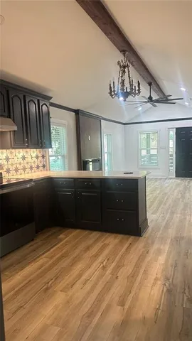 a bathroom with a sink double vanity and a large mirror