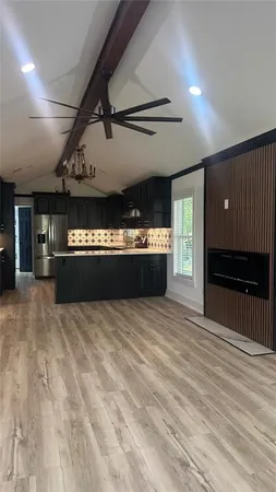 a large hall with an empty space and a stove