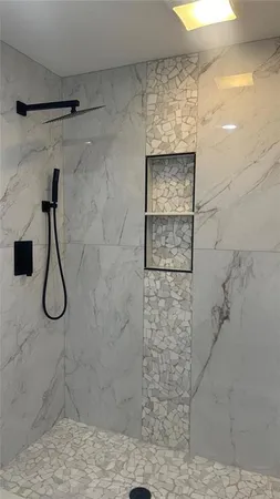 a bathroom with a double vanity sink and mirror