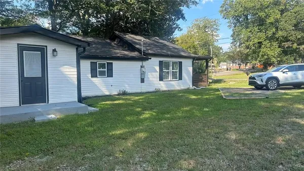 a view of a tree with a yard