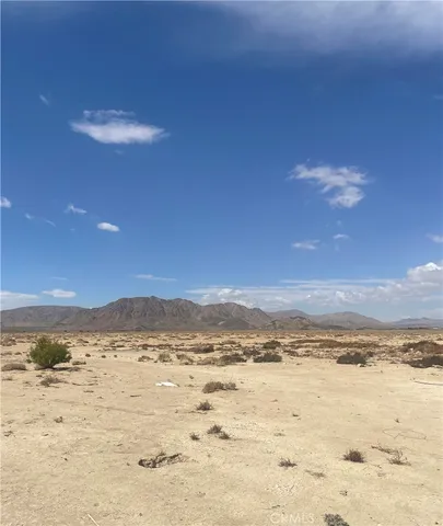 a view of swimming pool with a yard