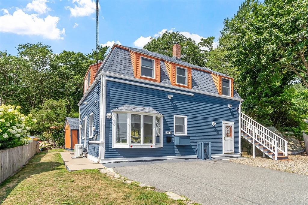 a front view of a house with a patio