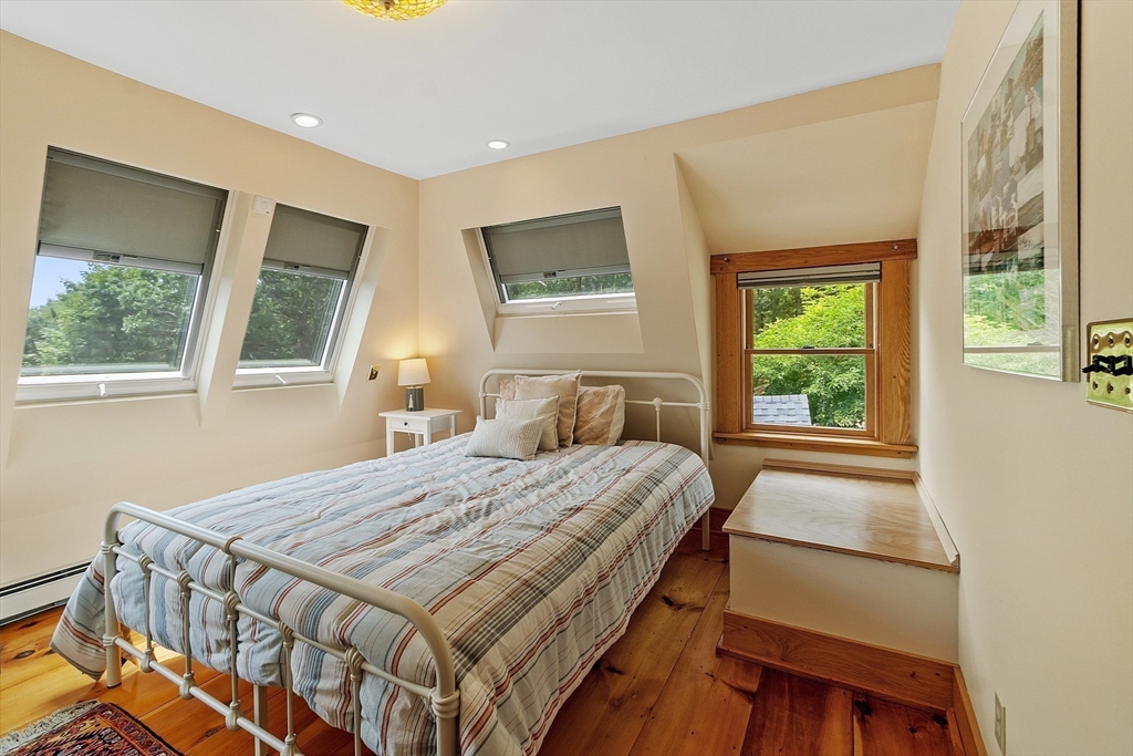 205 R Western Avenue Gloucester, MA 01930 - Photo 14 of 30 a bedroom with a bed and a window