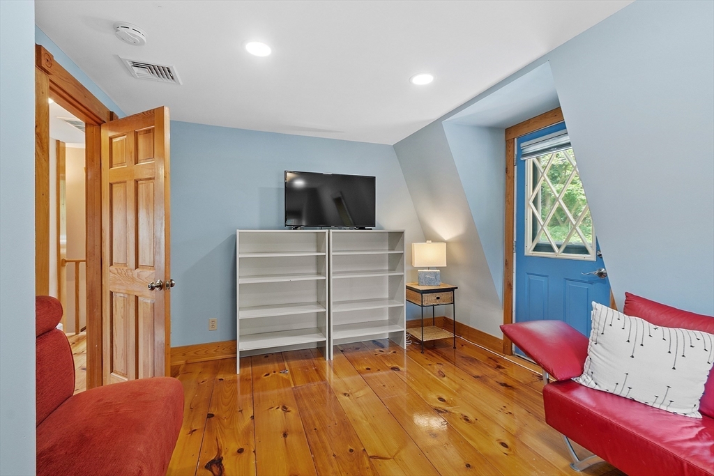 205 R Western Avenue Gloucester, MA 01930 - Photo 17 of 30 a bedroom with a bed and furniture