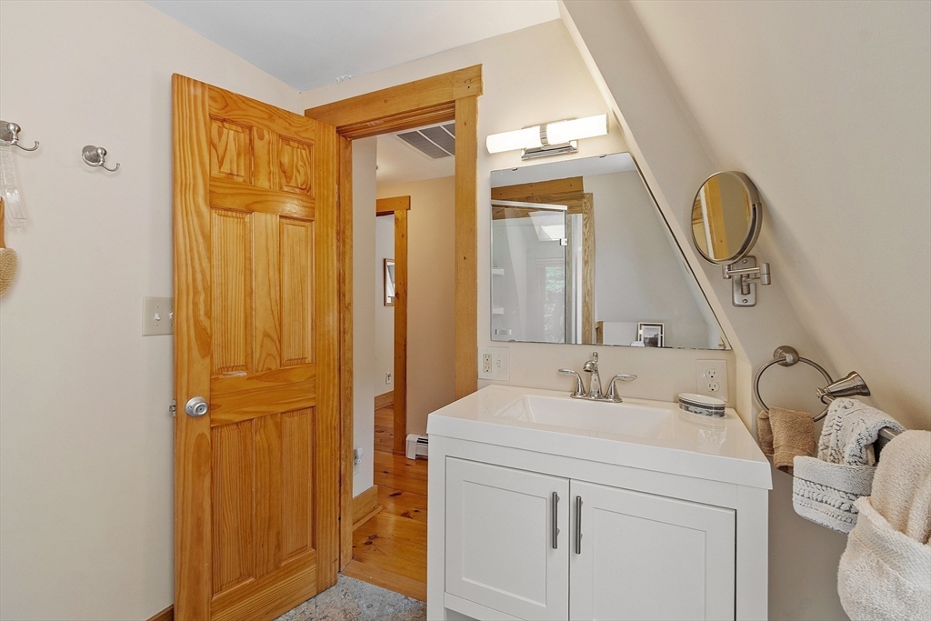 205 R Western Avenue Gloucester, MA 01930 - Photo 19 of 30 a bathroom with a sink a vanity and a mirror