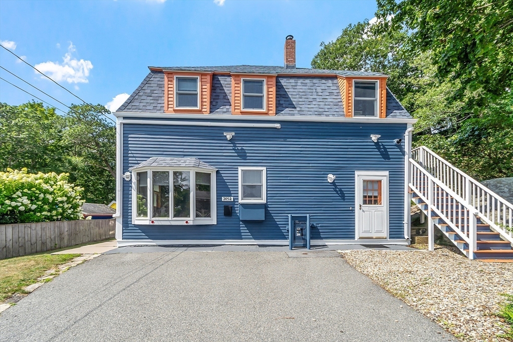 205 R Western Avenue Gloucester, MA 01930 - Photo 26 of 30 a front view of a house with a yard