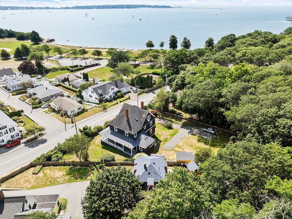 205 R Western Avenue Gloucester, MA 01930 - Photo 27 of 30 an aerial view of a house with a yard and lake view