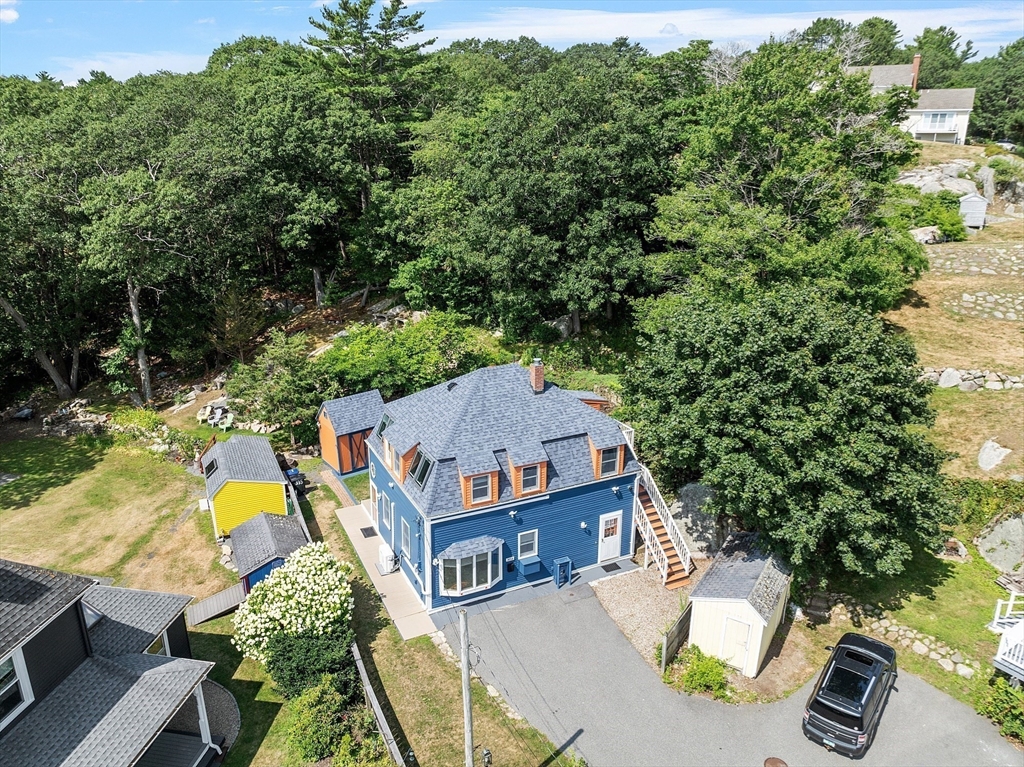 205 R Western Avenue Gloucester, MA 01930 - Photo 29 of 30 an aerial view of a house with swimming pool and large trees