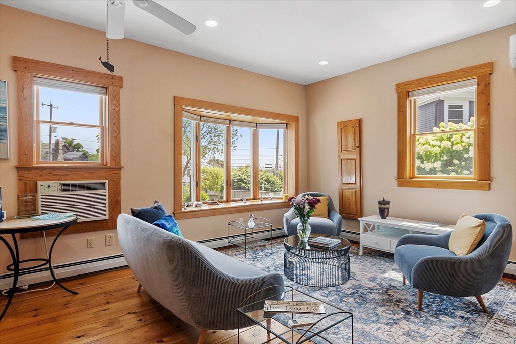 205 R Western Avenue Gloucester, MA 01930 - Photo 4 of 30 a living room with furniture and floor to ceiling windows