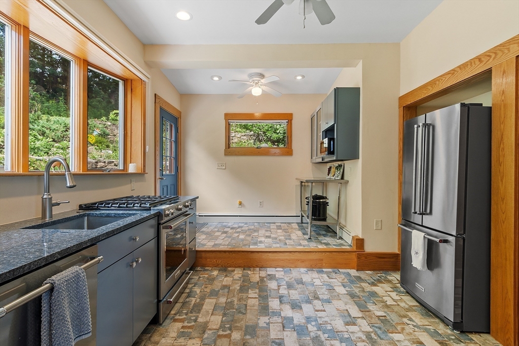 205 R Western Avenue Gloucester, MA 01930 - Photo 9 of 30 a kitchen with sink refrigerator and window