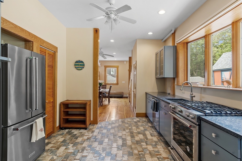 205 R Western Avenue Gloucester, MA 01930 - Photo 10 of 30 a kitchen with stainless steel appliances a refrigerator sink and stove