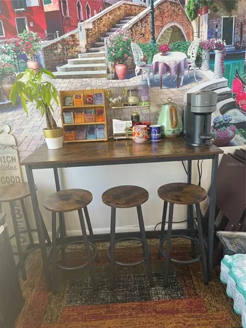 a kitchen with a table and chairs in it