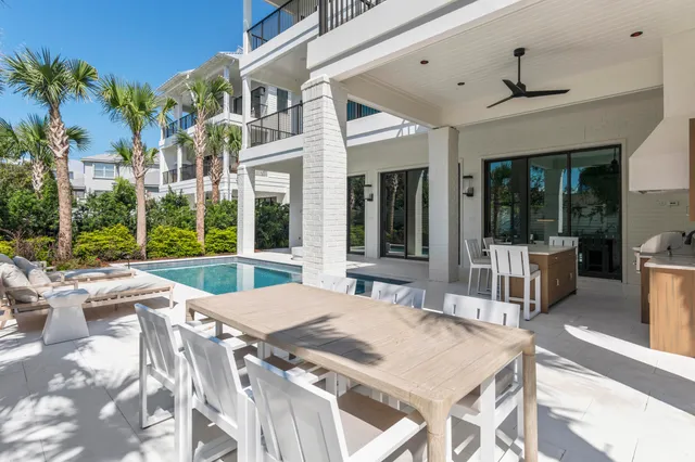 a living room with furniture fireplace and a large window