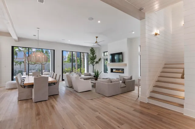 a kitchen with stainless steel appliances granite countertop a sink a stove and a refrigerator