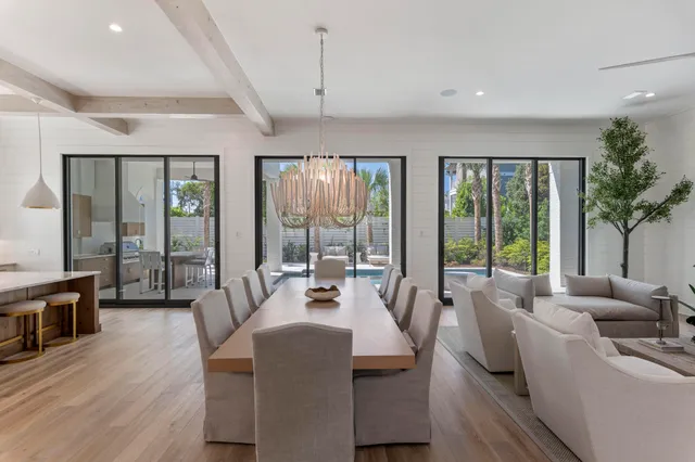 a view of living room with furniture and a chandelier