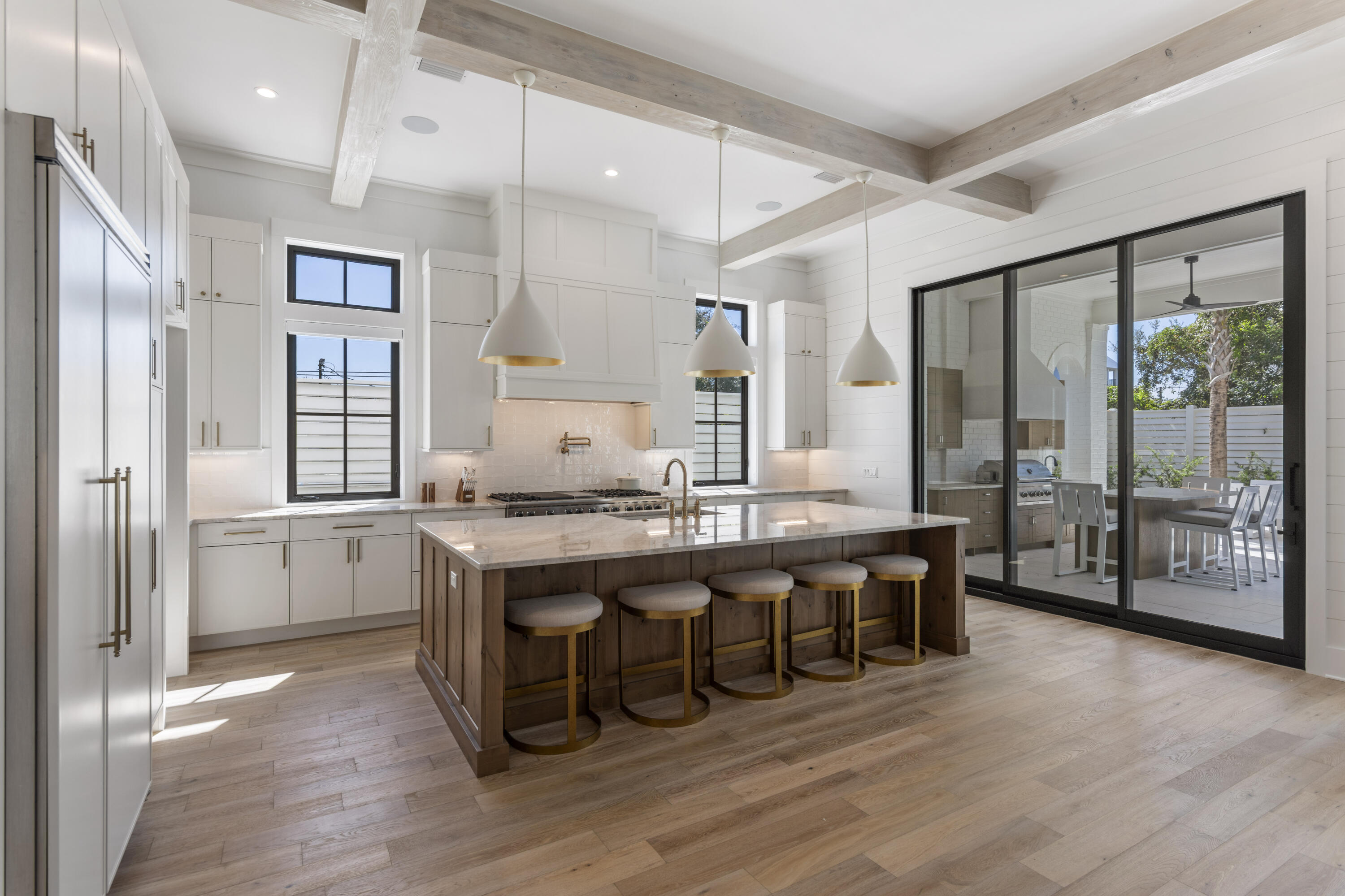 140 South Wall Street Inlet Beach, FL 32461 - Photo 22 of 82 a large kitchen with a table and chairs