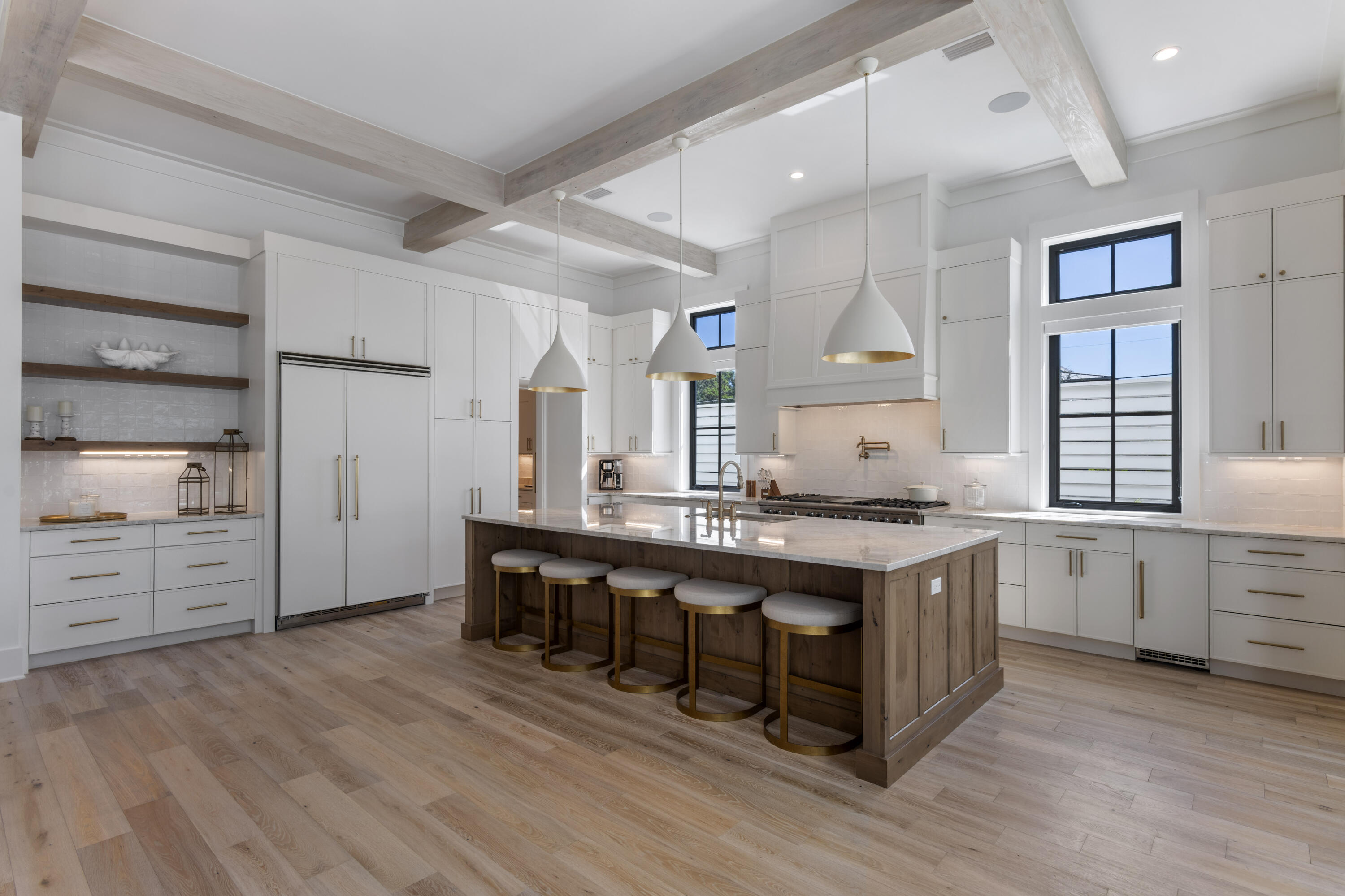 140 South Wall Street Inlet Beach, FL 32461 - Photo 25 of 82 a large kitchen with cabinets wooden floor and stainless steel appliances