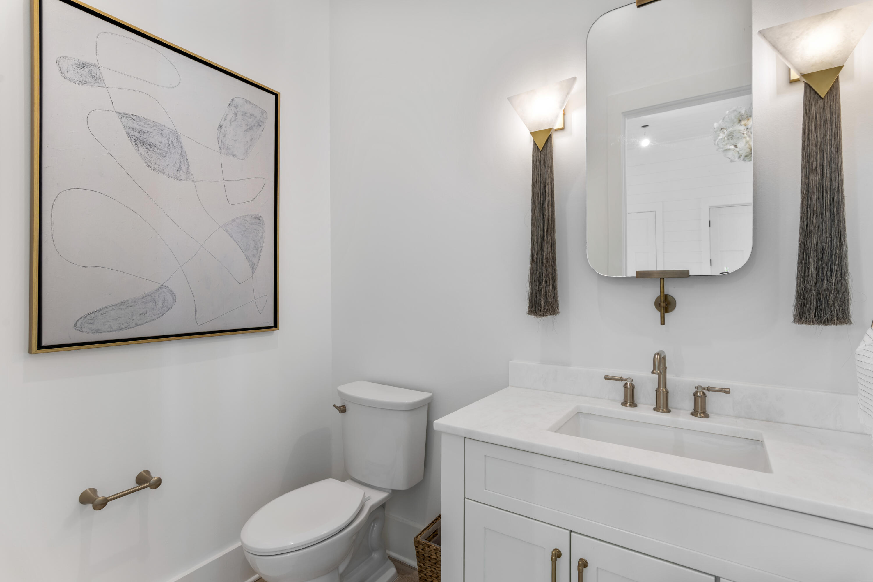 140 South Wall Street Inlet Beach, FL 32461 - Photo 38 of 82 a bathroom with a toilet sink and mirror