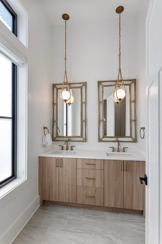 a bedroom with furniture and a large window