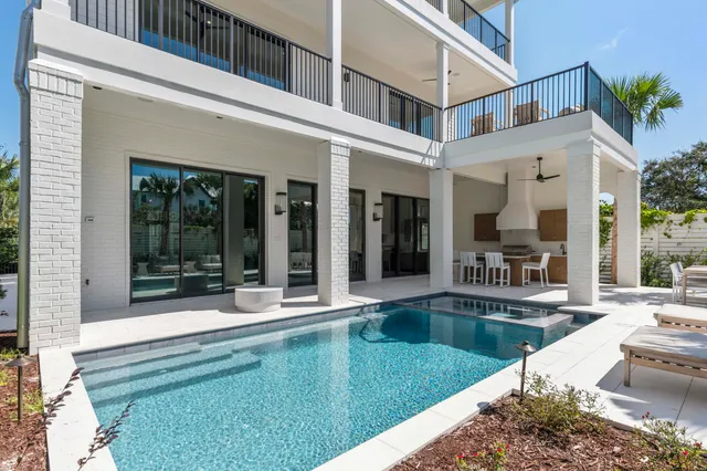 a view of a patio with couches table and chairs