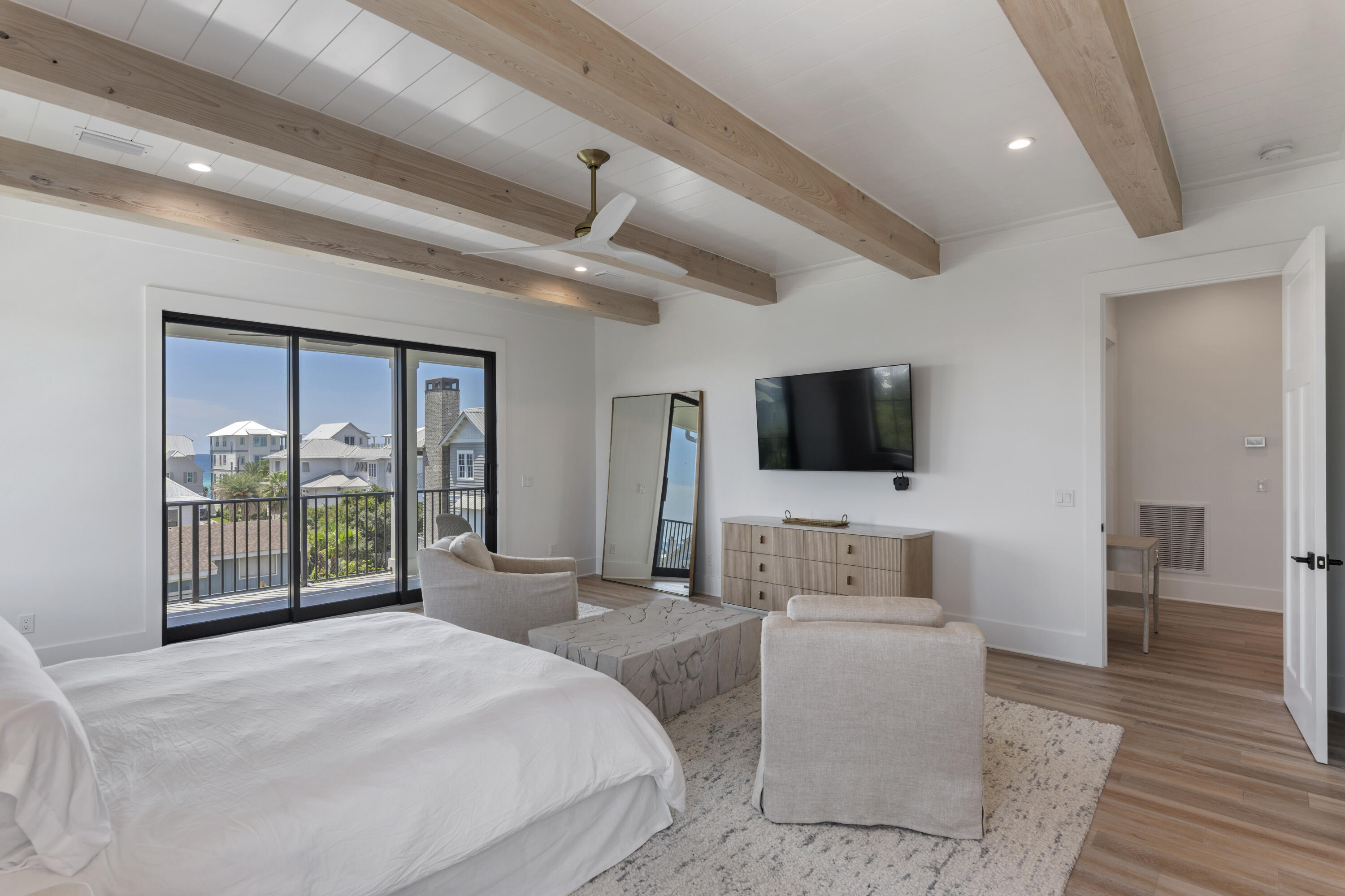 140 South Wall Street Inlet Beach, FL 32461 - Photo 66 of 82 a bedroom with a bed and a flat screen tv