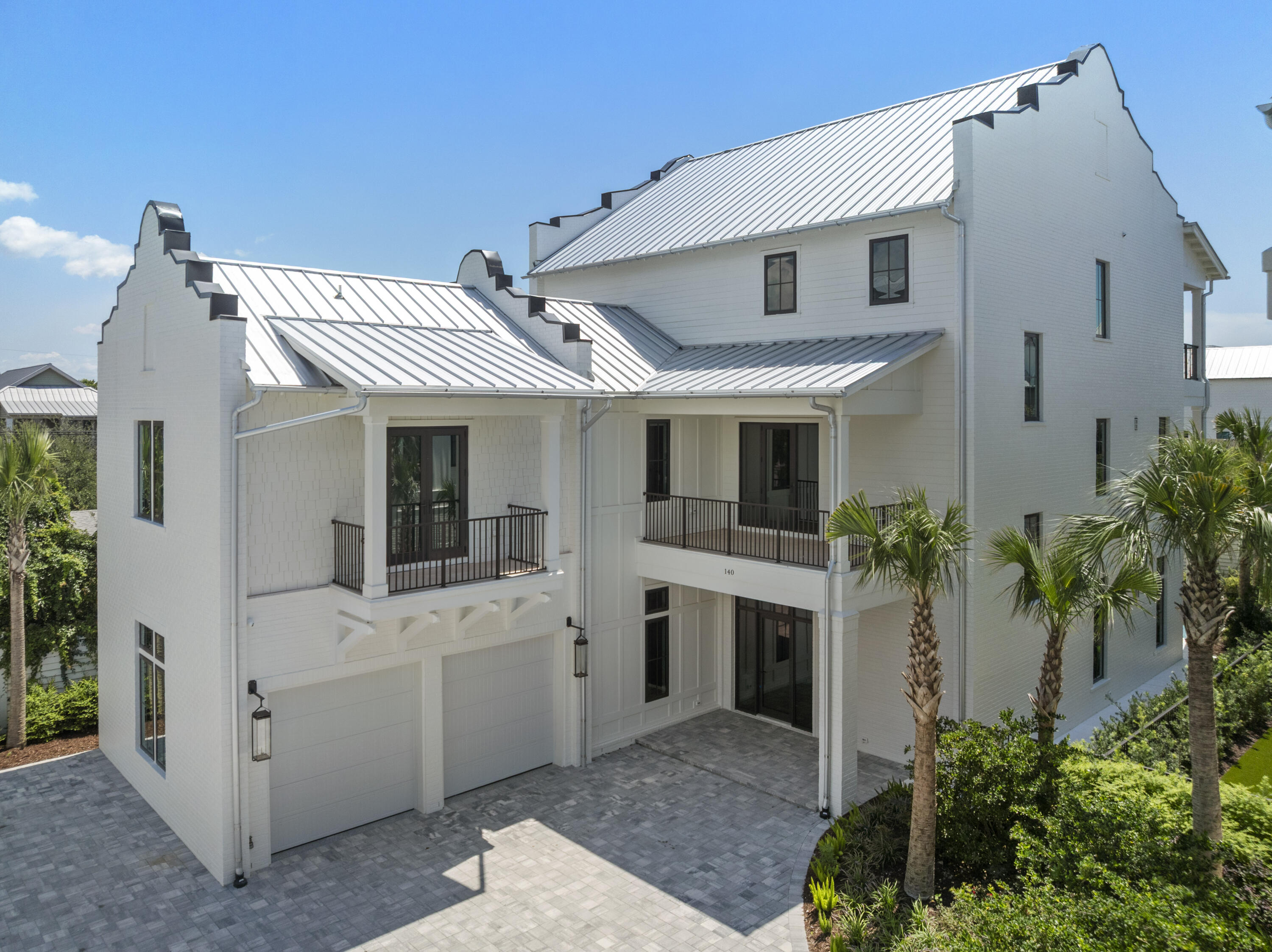 140 South Wall Street Inlet Beach, FL 32461 - Photo 80 of 82 a view of a white house with a small yard and potted plants