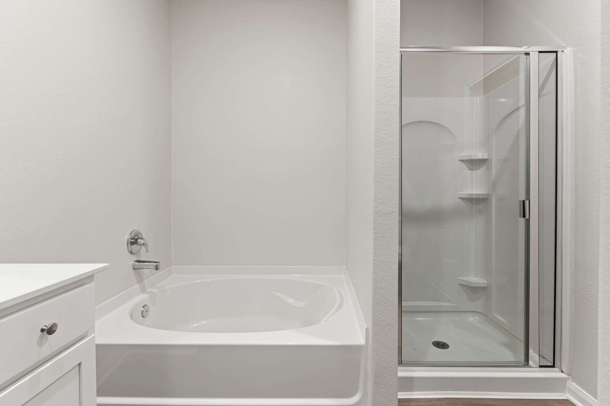 8946 Ice Quartz Drive Iowa Colony, TX 77583 - Photo 6 of 15 a bathroom with a bathtub and a shower