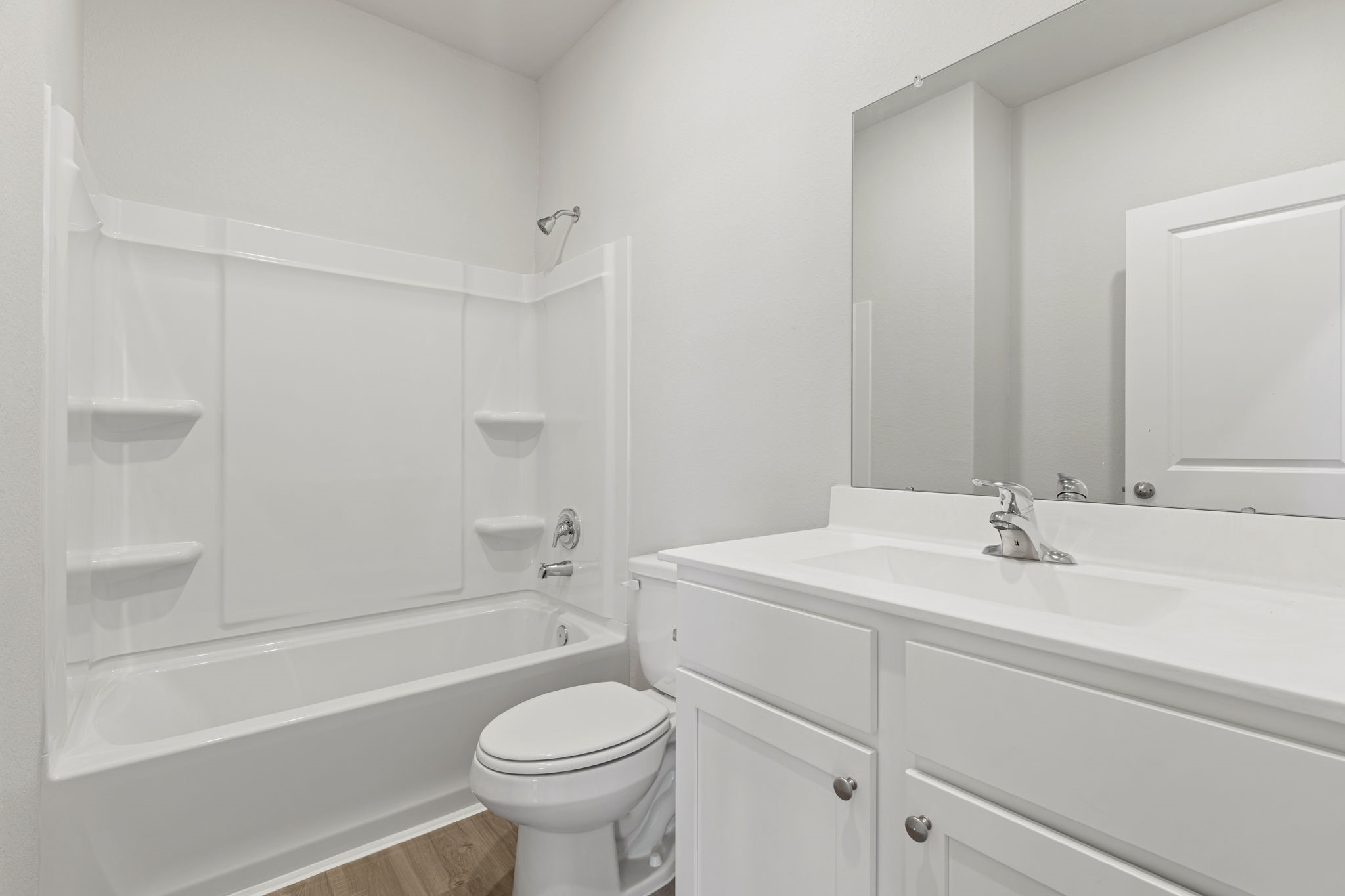 8946 Ice Quartz Drive Iowa Colony, TX 77583 - Photo 9 of 15 a bathroom with a sink a toilet and shower