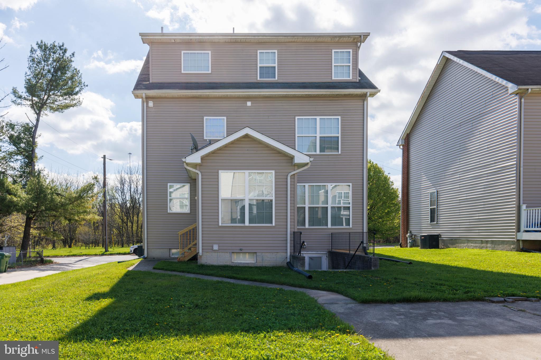 4704 Denview Way Baltimore, MD 21206 - Photo 35 of 42 a front view of a house with garden