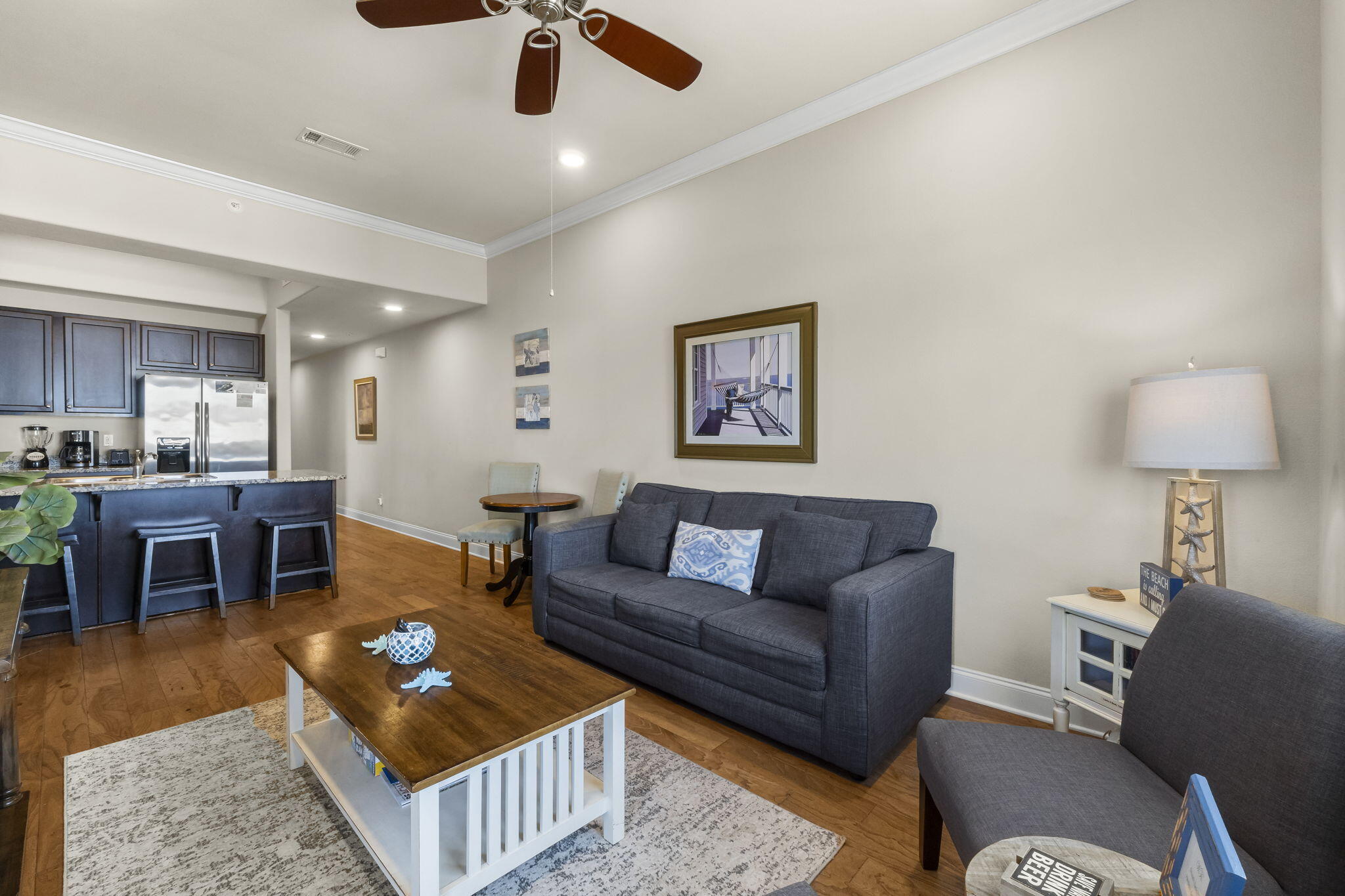 732 Scenic Gulf Drive, Unit E304 Destin, FL 32550 - Photo 20 of 34 a living room with furniture and a dining table