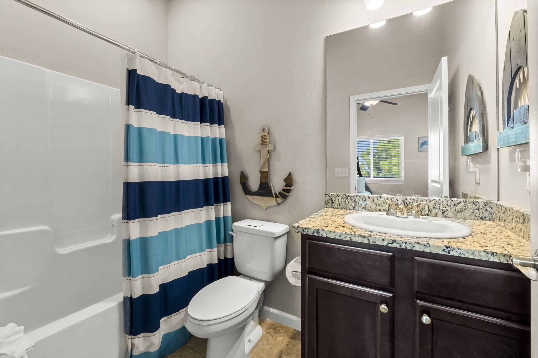 732 Scenic Gulf Drive, Unit E304 Destin, FL 32550 - Photo 23 of 34 a bathroom with a sink a toilet and shower