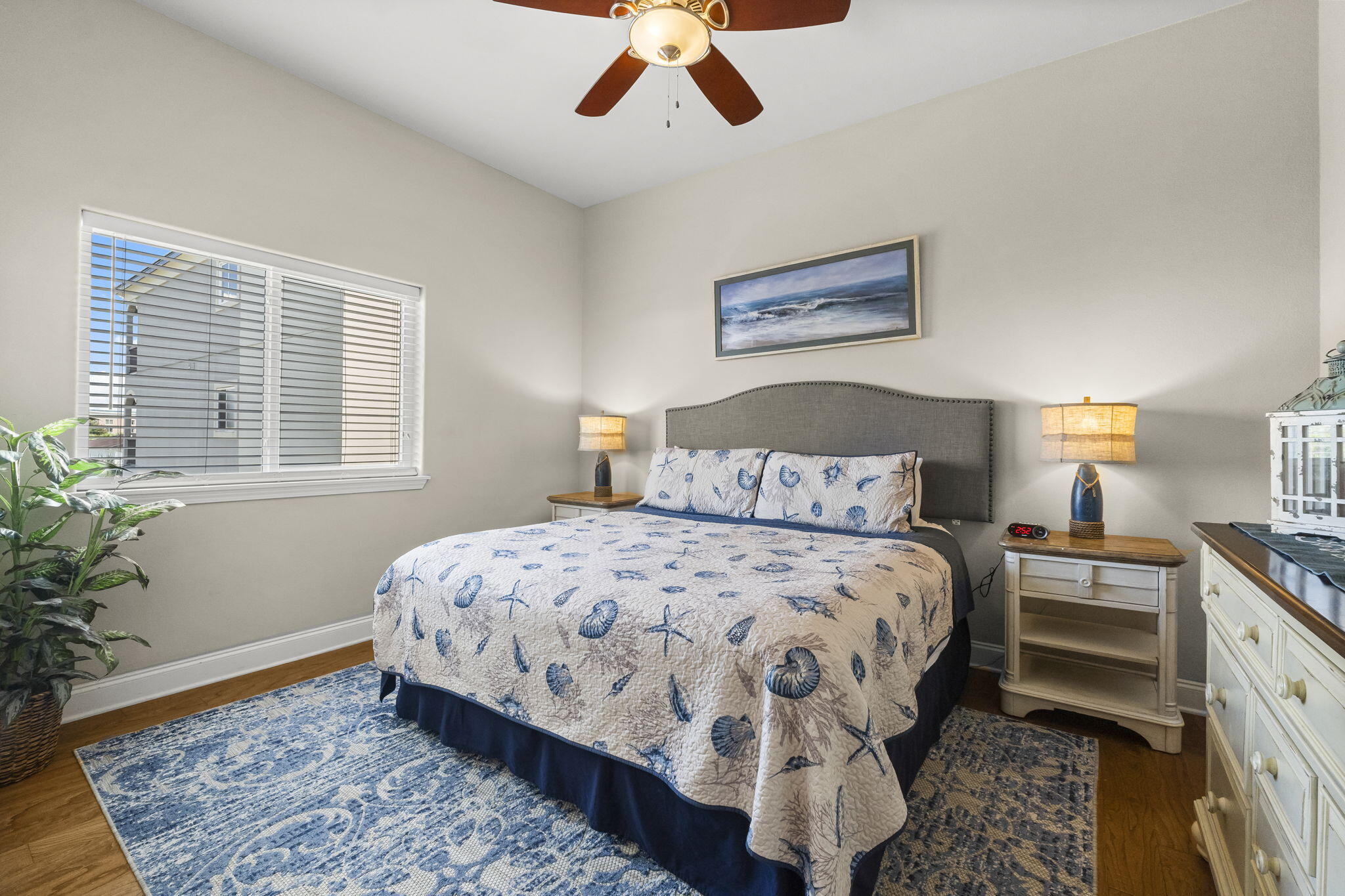732 Scenic Gulf Drive, Unit E304 Destin, FL 32550 - Photo 8 of 34 a bedroom with a large bed and a potted plant