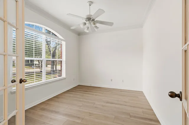 a view of a hallway with wooden shelves