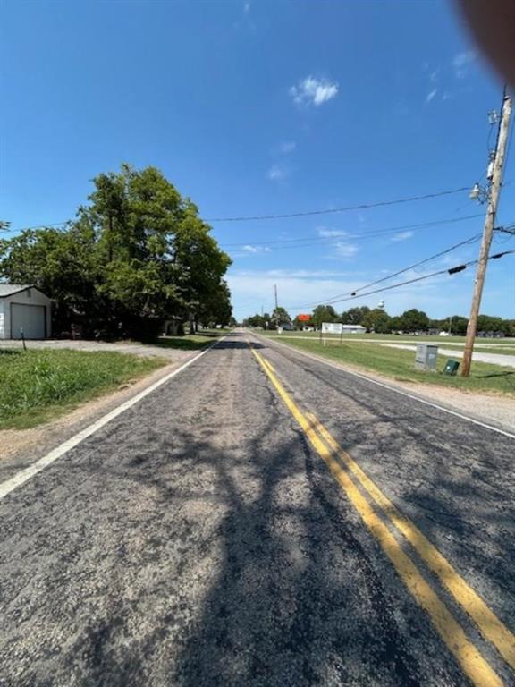 306 South Pecan Street Bells, TX 75414 - Photo 5 of 9 a view of a dry yard with wooden fence