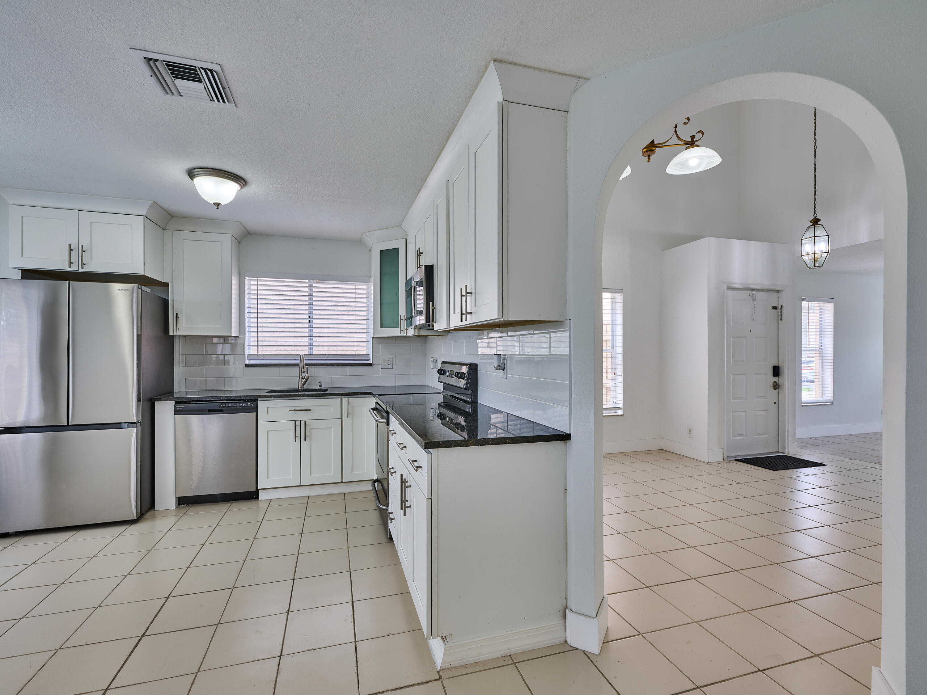 6813 Torch Key Street Lake Worth, FL 33467 - Photo 6 of 30 View from kitchen and front Door