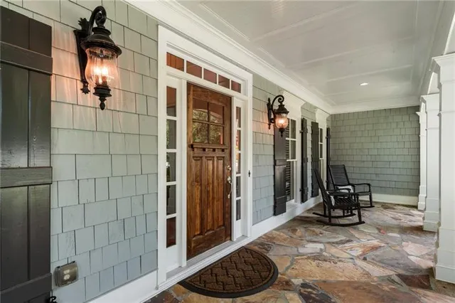 a kitchen with granite countertop a sink a stove and cabinets