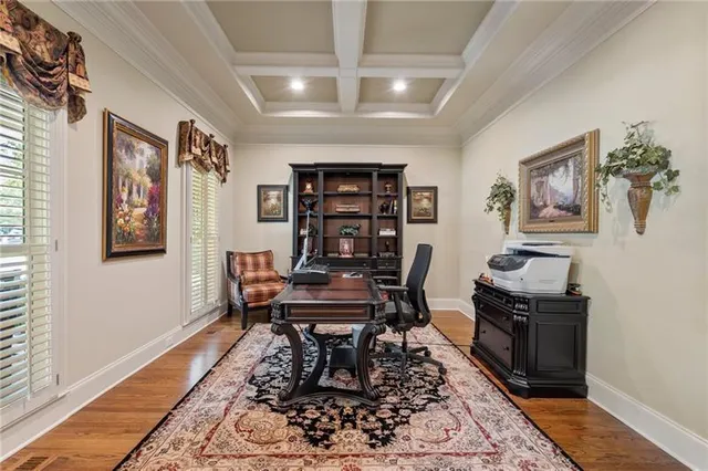 a view of a livingroom with furniture and a flat screen tv