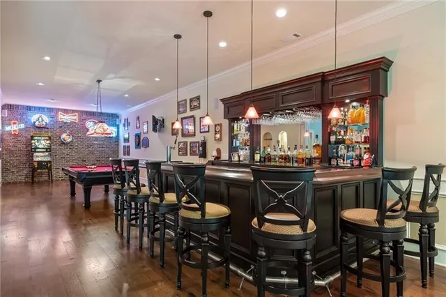 a view of a dining room with furniture wooden floor and chandelier
