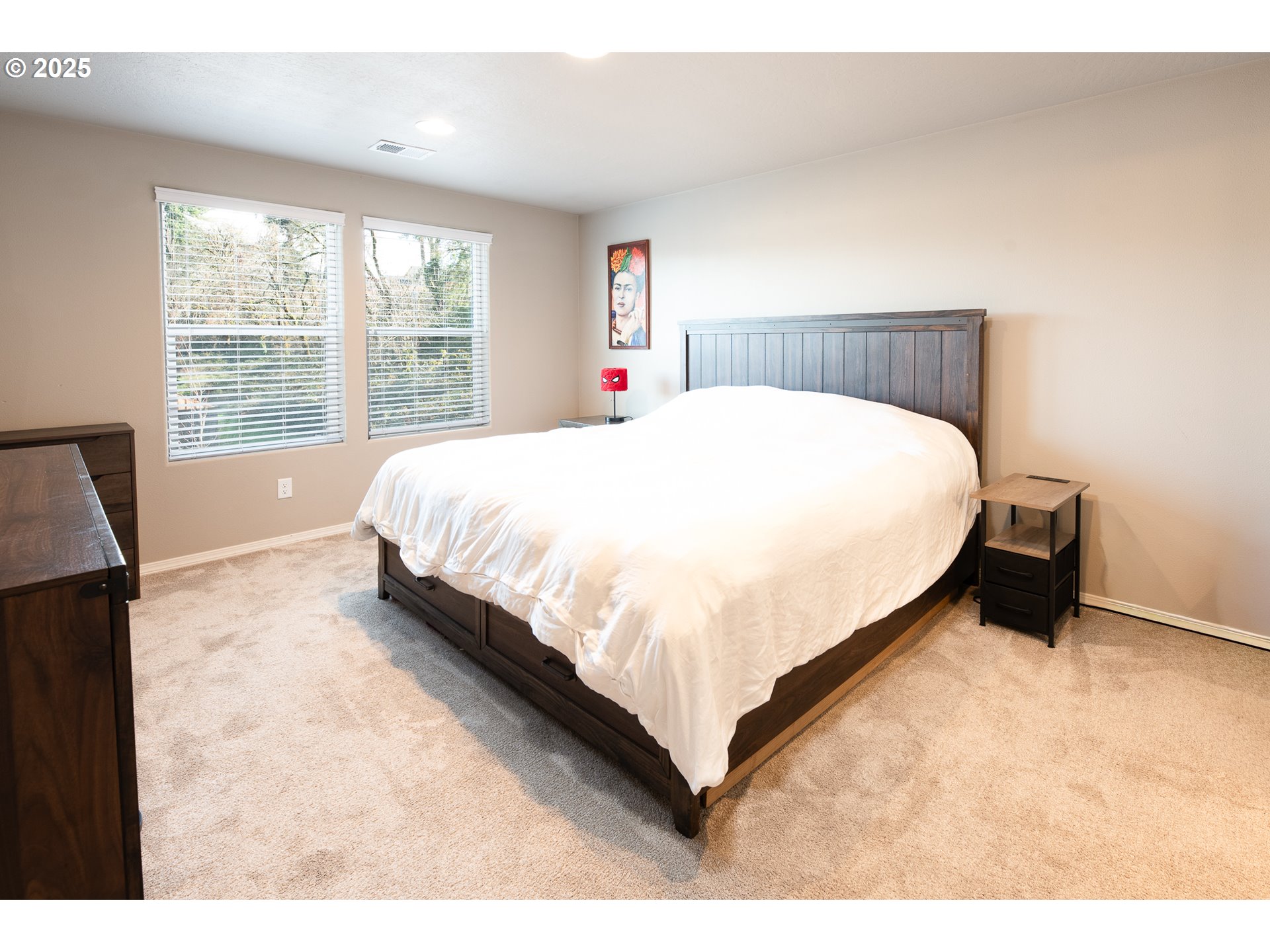 792 South 52nd Place Springfield, OR 97478 - Photo 18 of 45 a bed sitting in a bedroom next to a window