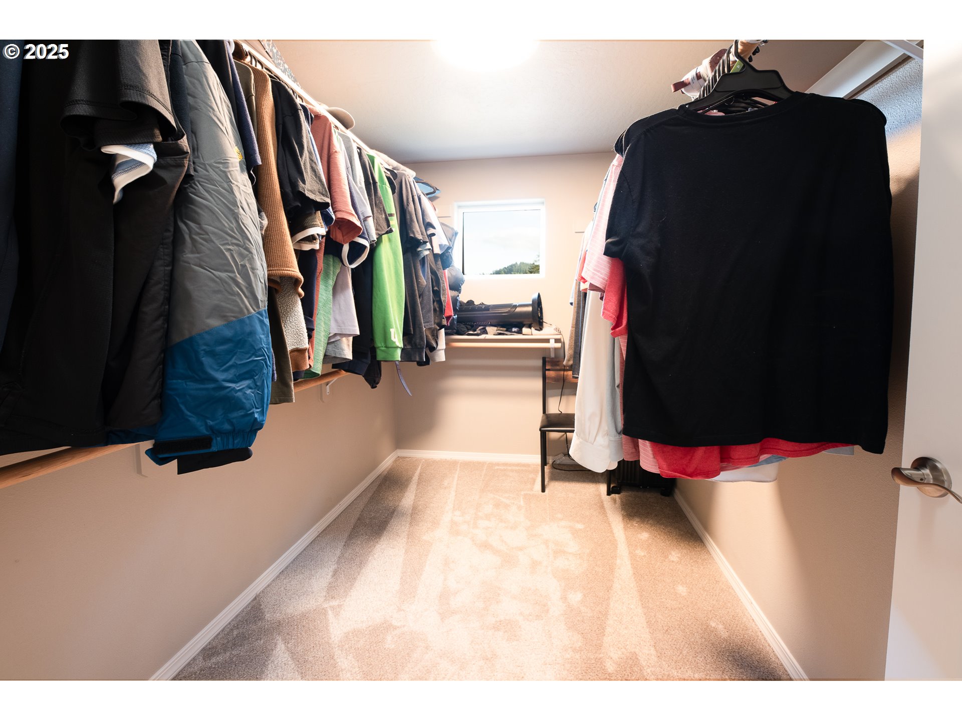 792 South 52nd Place Springfield, OR 97478 - Photo 20 of 45 a view of walk in closet with clothes and shoes