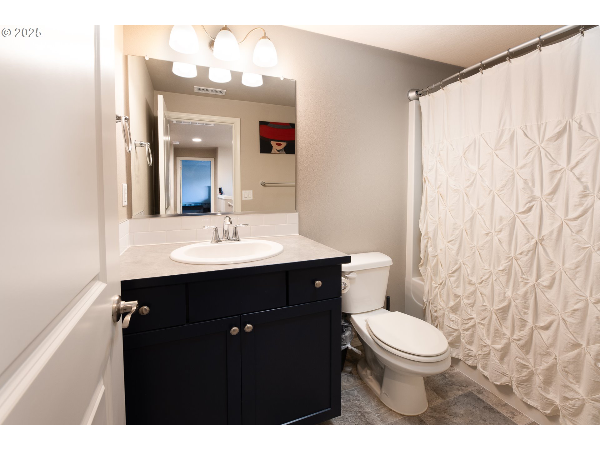792 South 52nd Place Springfield, OR 97478 - Photo 26 of 45 a bathroom with a sink vanity mirror and toilet