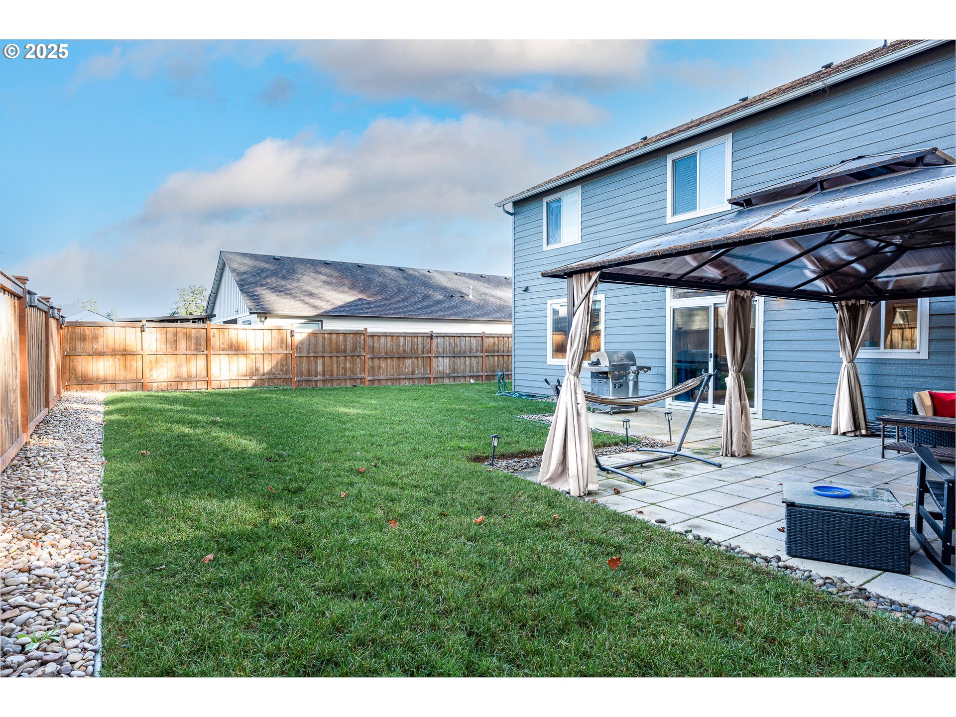 792 South 52nd Place Springfield, OR 97478 - Photo 43 of 45 a view of a backyard with table and chairs and potted plants