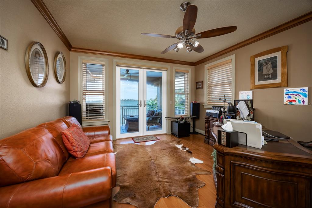 306 Harbor Drive Indian Rocks Beach, FL 33785 - Photo 32 of 58 a living room with furniture and a large window