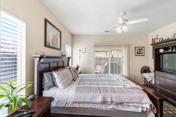 a bedroom with a bed furniture and a window