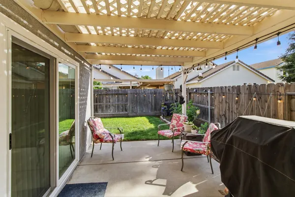 a patio with patio a couch and chairs