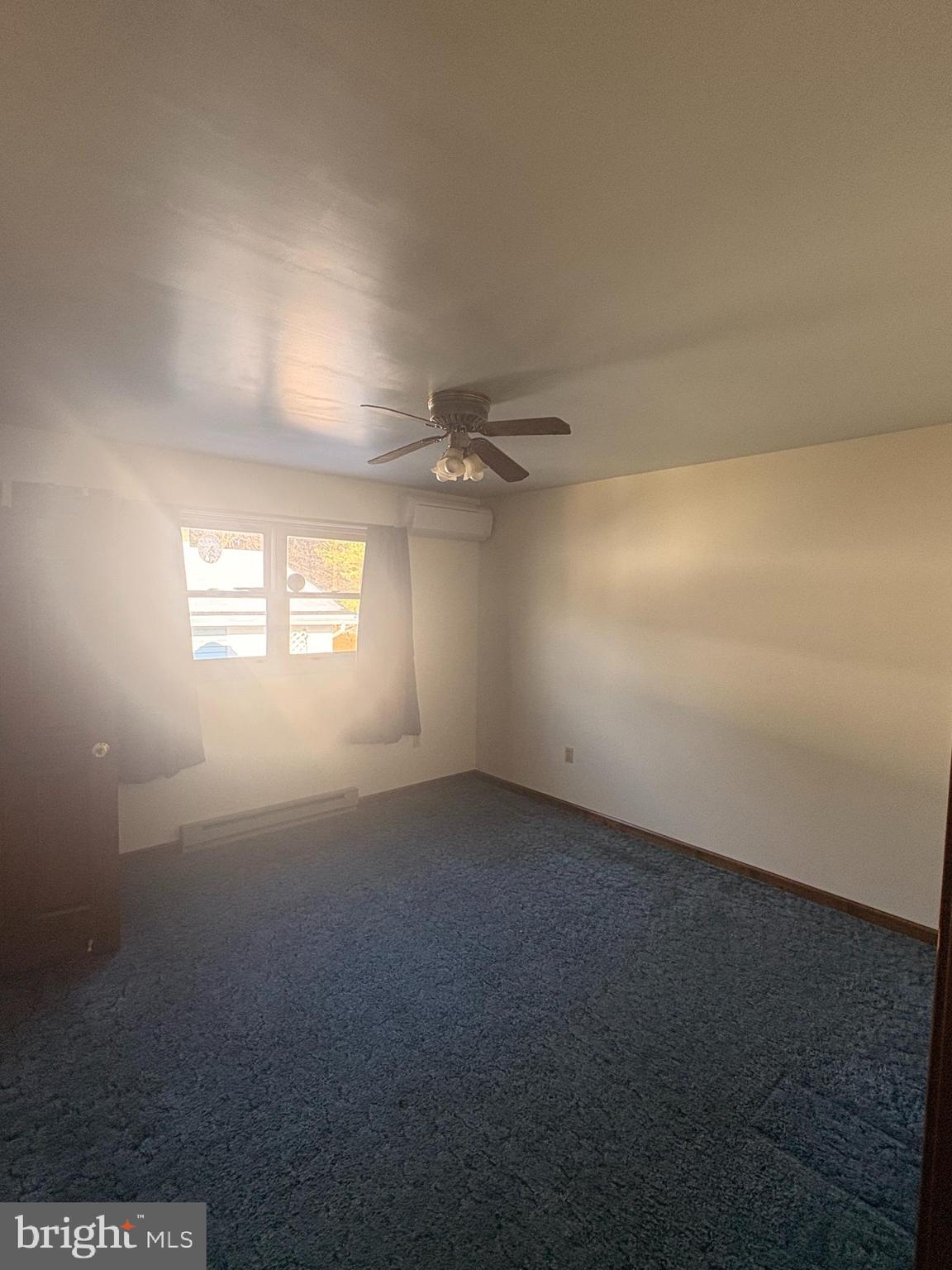 3189 Powells Valley Road Halifax, PA 17032 - Photo 18 of 44 an empty room with windows and fan